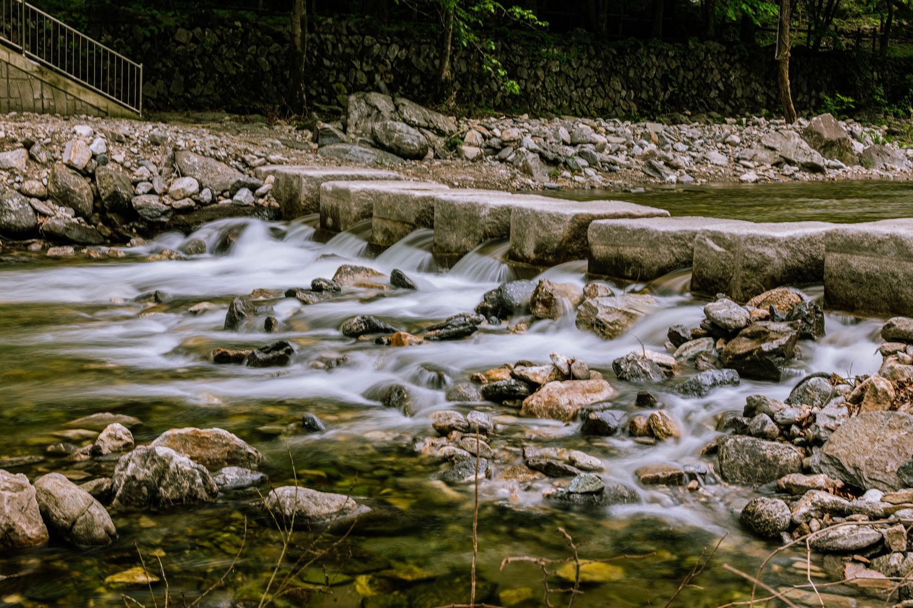 Stone bridge over a flowing river