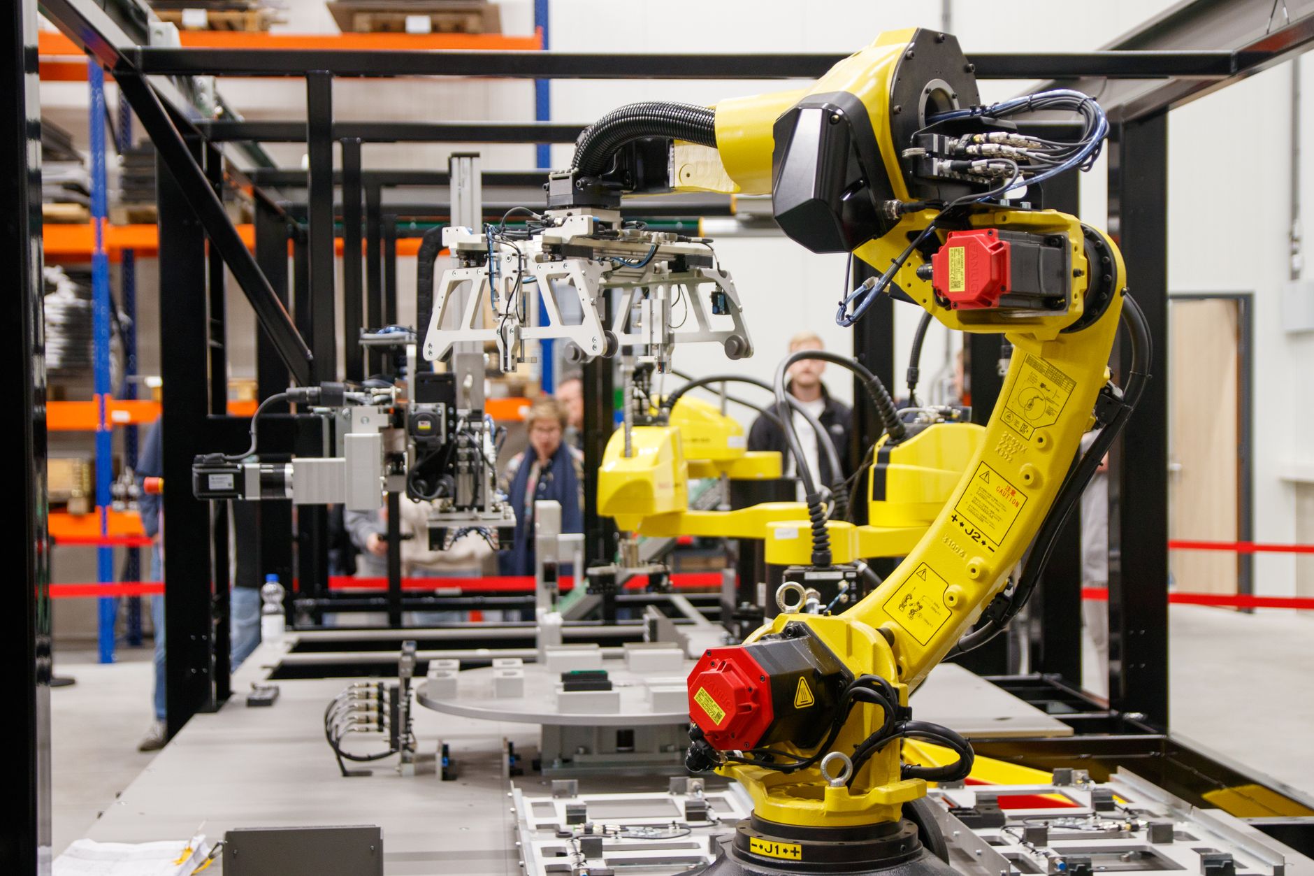 Yellow industrial robotic arm in manufacturing facility