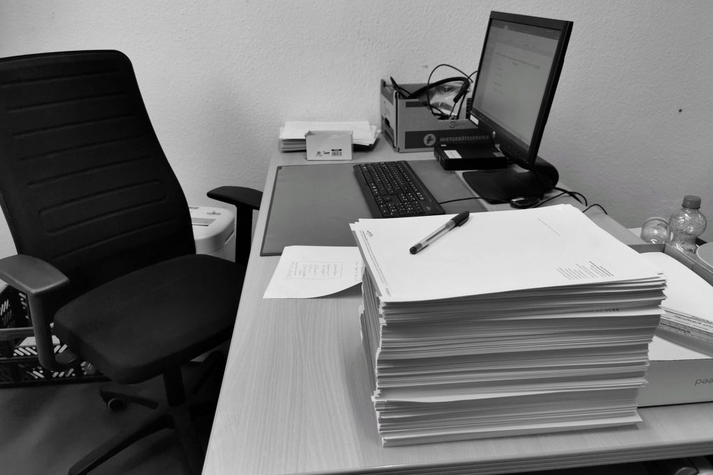 Office desk with documents and computer