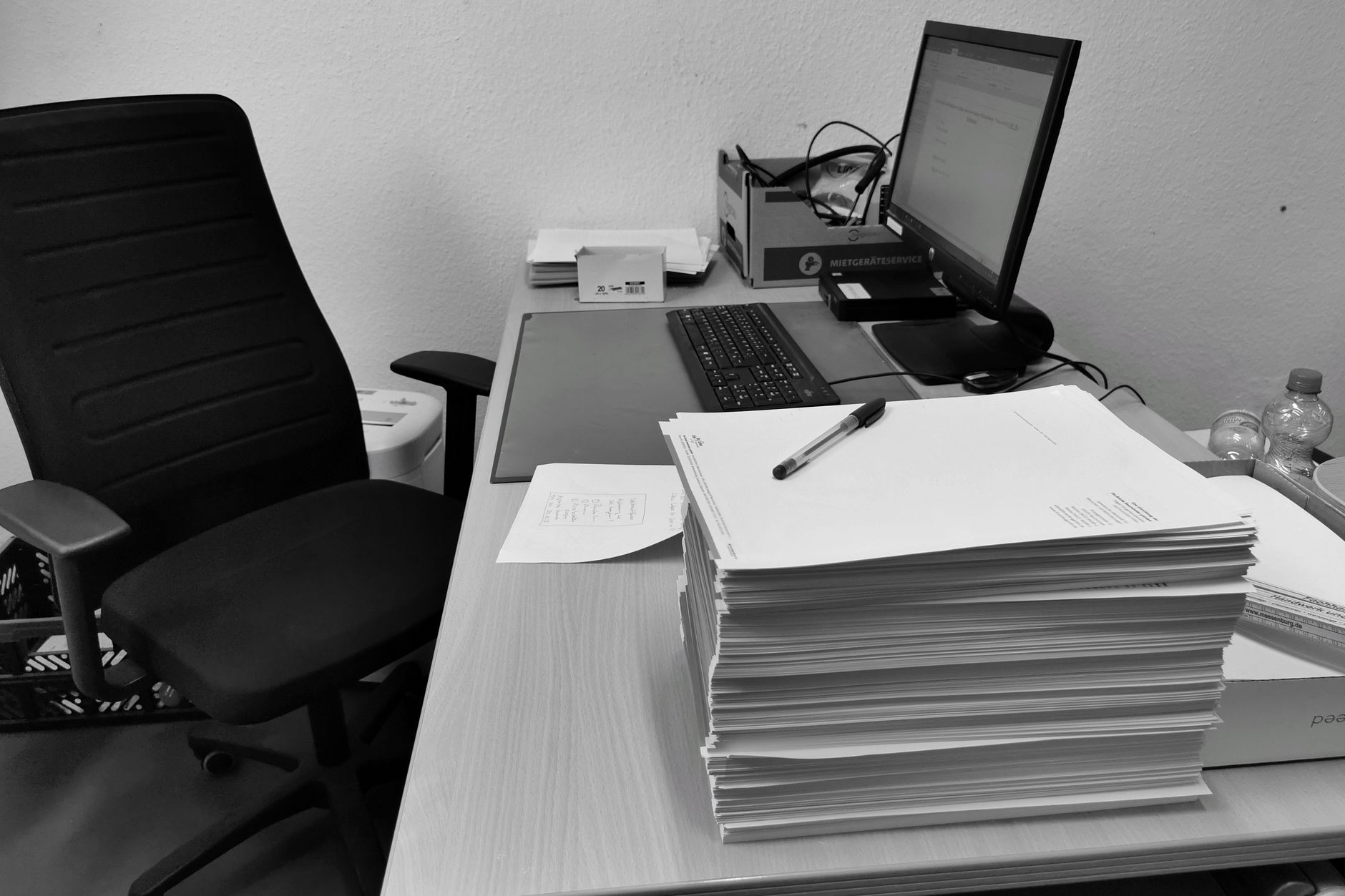 Office desk with documents and computer