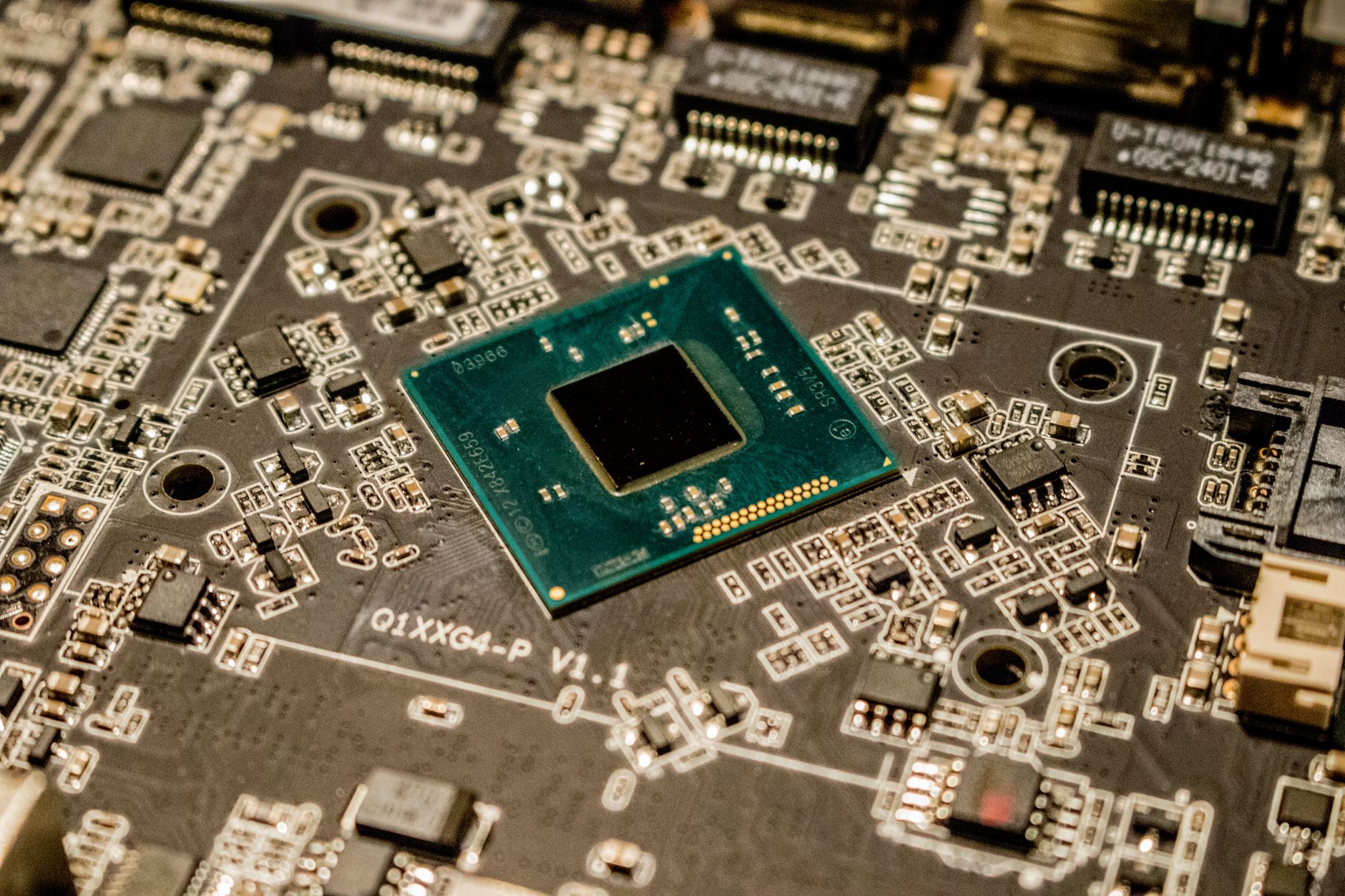 Detailed view of a microchip on a circuit board