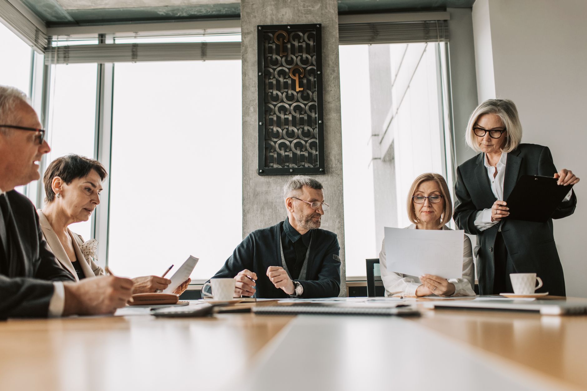 Business professionals discussing in a boardroom meeting