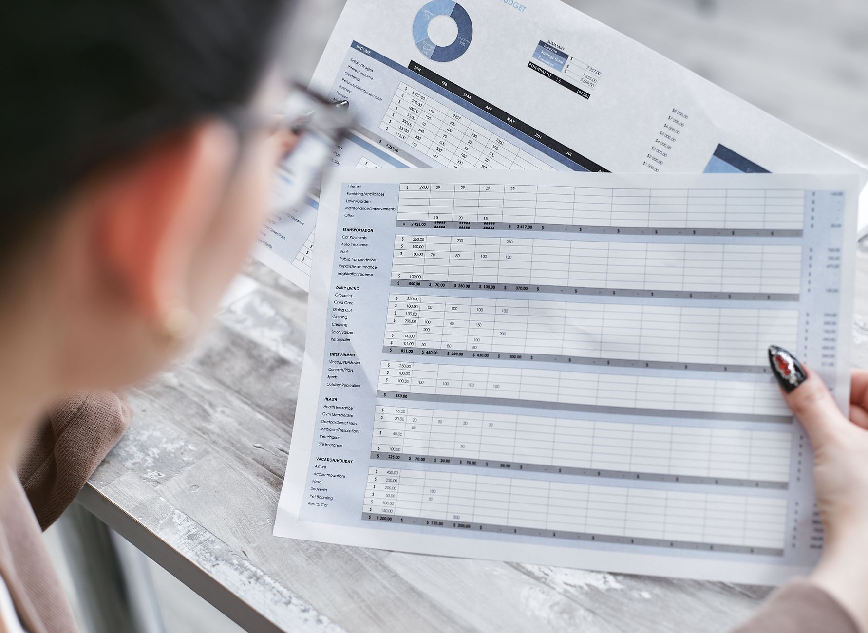 Businesswoman reviewing financial spreadsheets