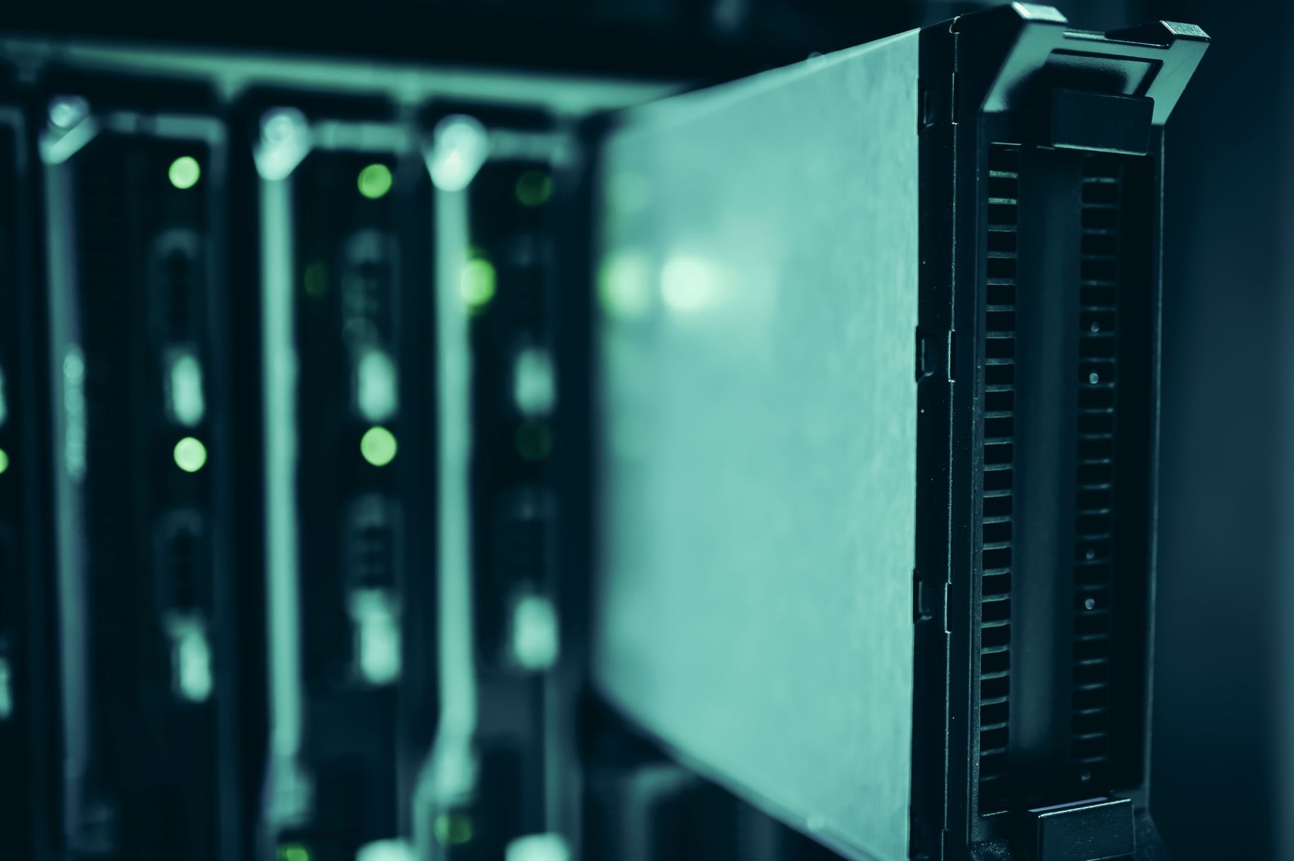 Close-up of server racks with active equipment in a data centre.