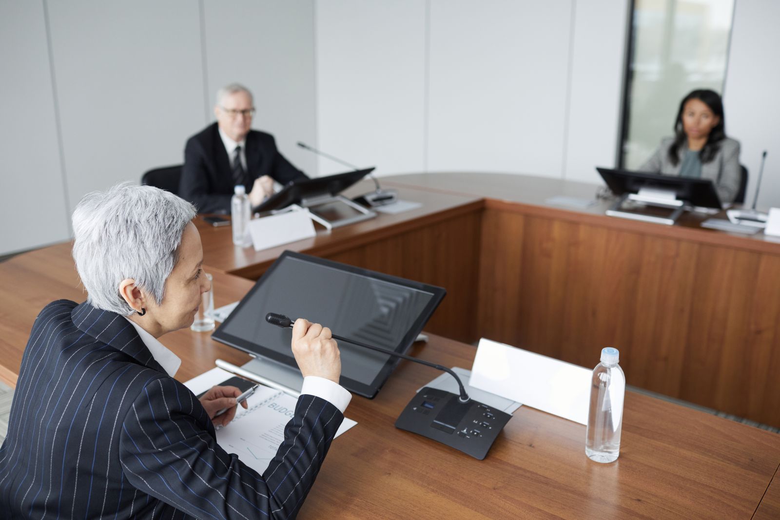 Senior executives in a boardroom discussion, representing board oversight of cryptographic risk